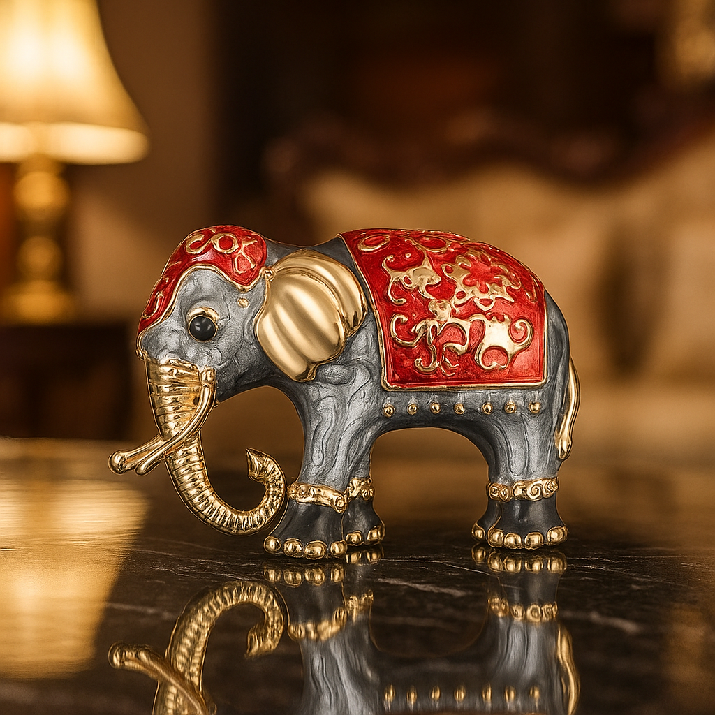 Decorative elephant figurine with red and gold accents on a reflective surface.