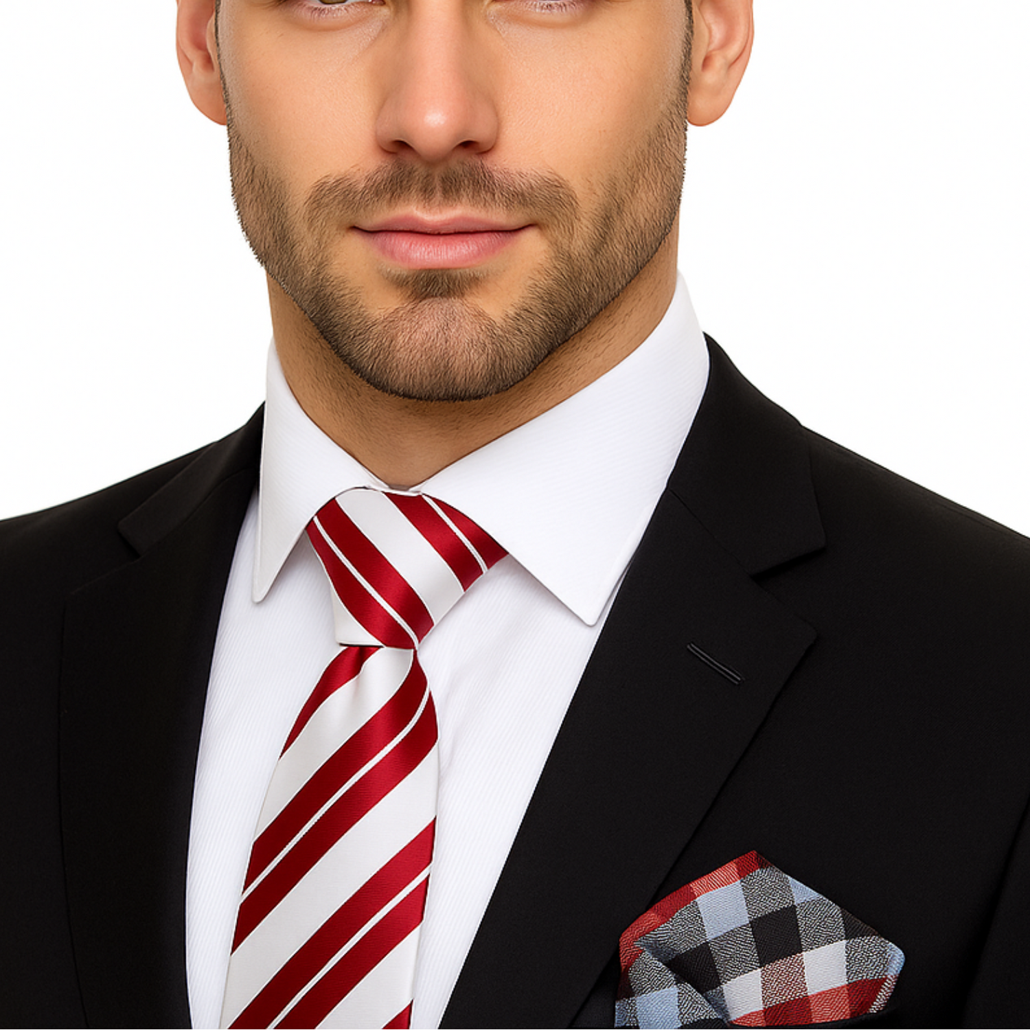 Man wearing a black suit with a red and white striped tie and checkered pocket square on a white background