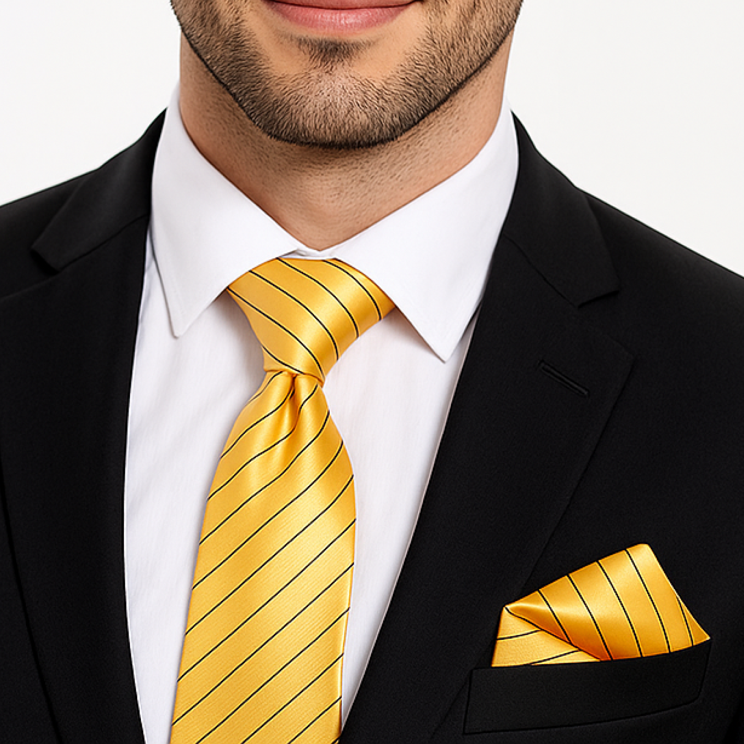 Man wearing a black suit with a yellow striped tie and pocket square on a white background