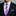 Man wearing a black suit with a white shirt, purple polka dot tie, and matching pocket square.