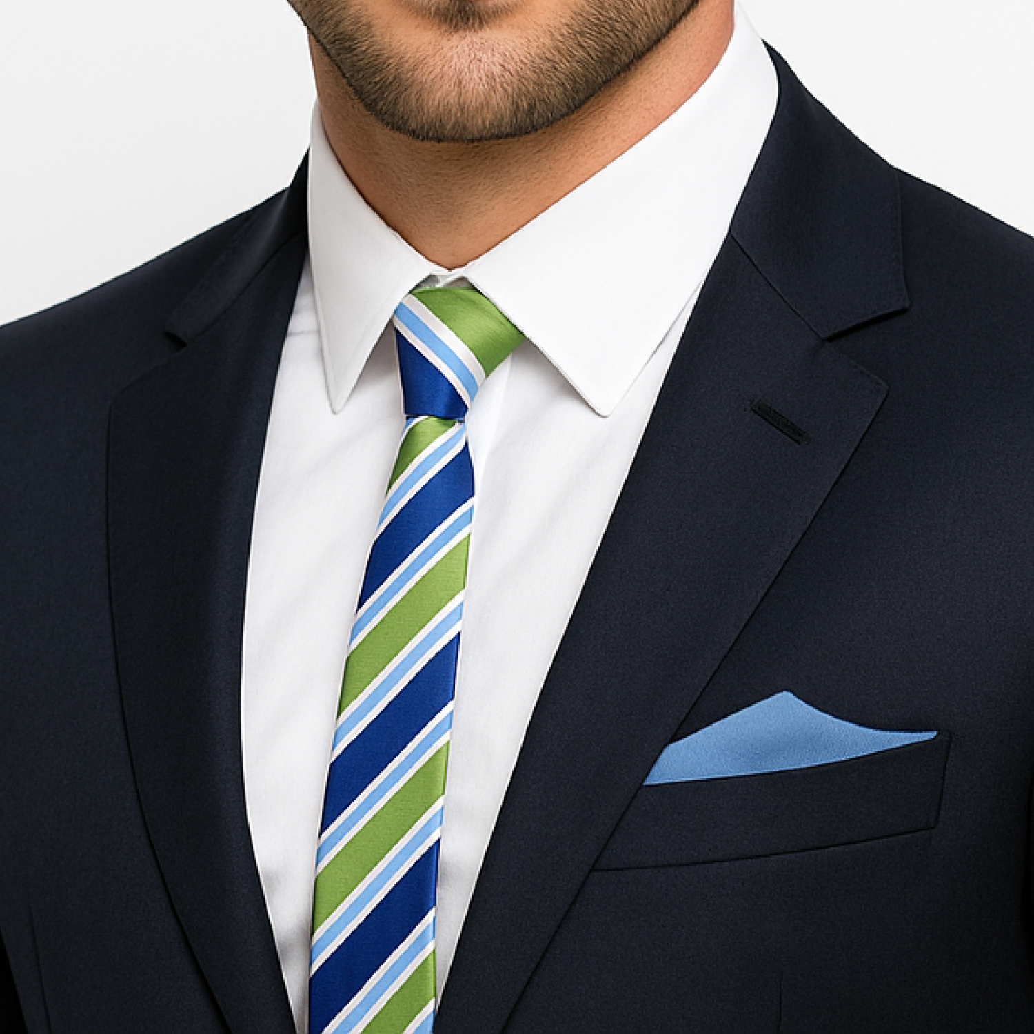 Man wearing a navy suit with a striped tie and blue pocket square.