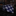 Navy blue tie with white chevron pattern on a dark marble surface