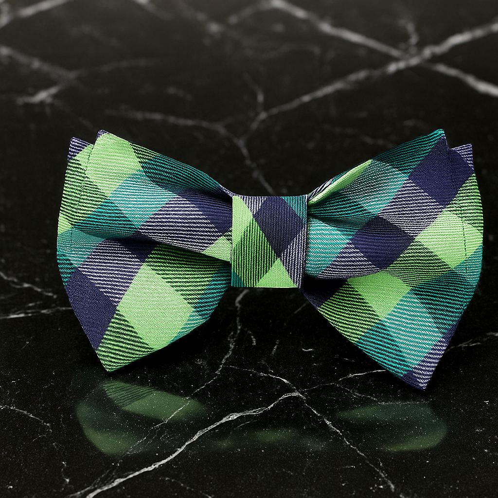 Green and blue checkered bow tie on a black marble background