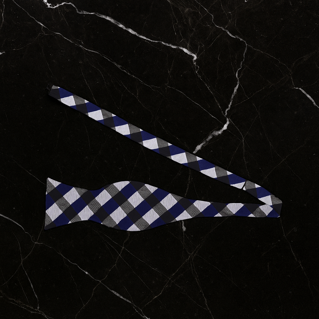Blue and white checkered bow tie on a black marble background