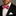 Man wearing a black tuxedo with a red, white, and blue striped bow tie.