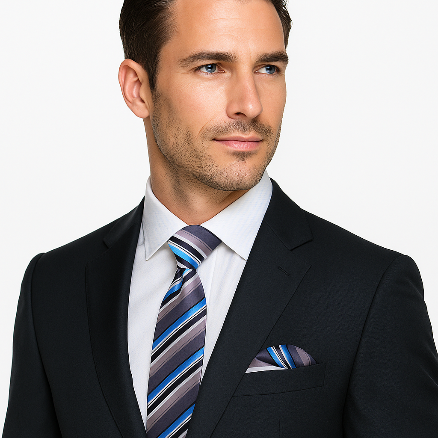 Man wearing a black suit with a striped tie and pocket square on a white background