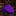 Purple tie with pink polka dots on a dark surface