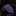 Rolled-up purple polka patterned tie on a dark surface