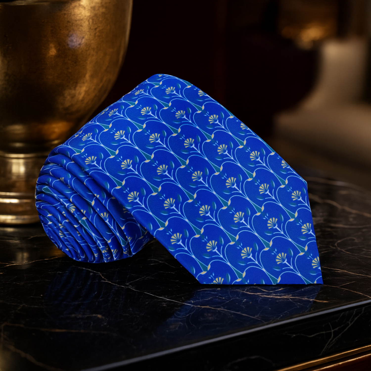 Blue patterned box on a dark surface with a blurred background