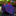Rolled-up blue and red patterned tie on a dark surface with a blurred floral background