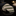 Folded green and beige striped tie on a dark surface