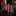 Striped tie with red, black, and white pattern on a dark surface