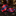 A matching necktie and pocket square set with a red and navy blue argyle pattern, displayed on a polished black marble surface in an elegant, dark wood interior setting.