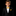 Young boy in a black suit with a yellow bow tie and pocket square on a black background