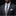 Man wearing a dark gray suit with a Abstract Graphic Necktie Black  White with Neon Green and Purple Accents and pocket square on a black background