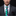 Man wearing a gray suit with a colorful tie and pocket square against a black background