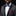 Man wearing a gray tuxedo with a colorful bow tie and pink handkerchief on a black background