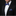 Man wearing a black suit with a blue and black polka dot bow tie and pocket square on a black background