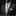 Man wearing a black suit with a floral tie and white pocket square on a dark background