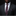 Man wearing a dark suit with a red and white patterned tie and pocket square against a black background