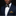 Man wearing a navy suit with a patterned bow tie and pocket square on a black background