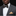 Man wearing black and gold dot bow tie and gold square