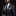 Man wearing a dark suit with a striped tie and patterned pocket square on a black background