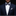 Man wearing a navy suit with a patterned bow tie and pocket square on a black background