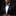 Man wearing a black tuxedo with a bow tie on a black background