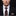 Man wearing a black suit with a Halloween-themed tie and pocket square.