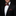 Man wearing a black suit with a red paisley bow tie and pocket square against a black background