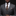 Man wearing a gray suit with a patterned tie against a black background