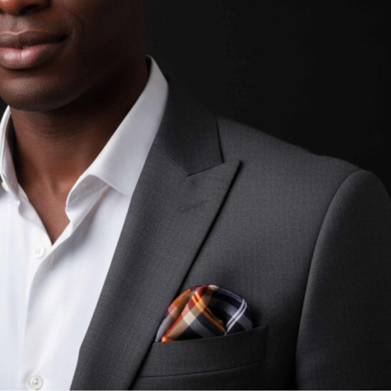 Man wearing black with orange plaid square