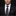 Man wearing a black suit with a patterned tie and pocket square on a dark background