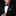 Man wearing a black suit with a patterned bow tie and pocket square on a dark background