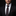Man wearing a black suit with a red paisley tie and pocket square on a dark background