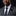 Man wearing a gray suit with a red and black flower pin on a black background