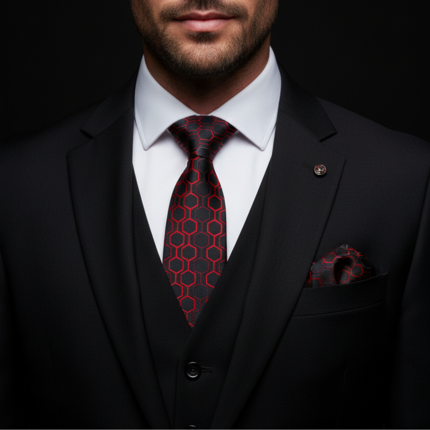 man wearing black and red geometric tie and square