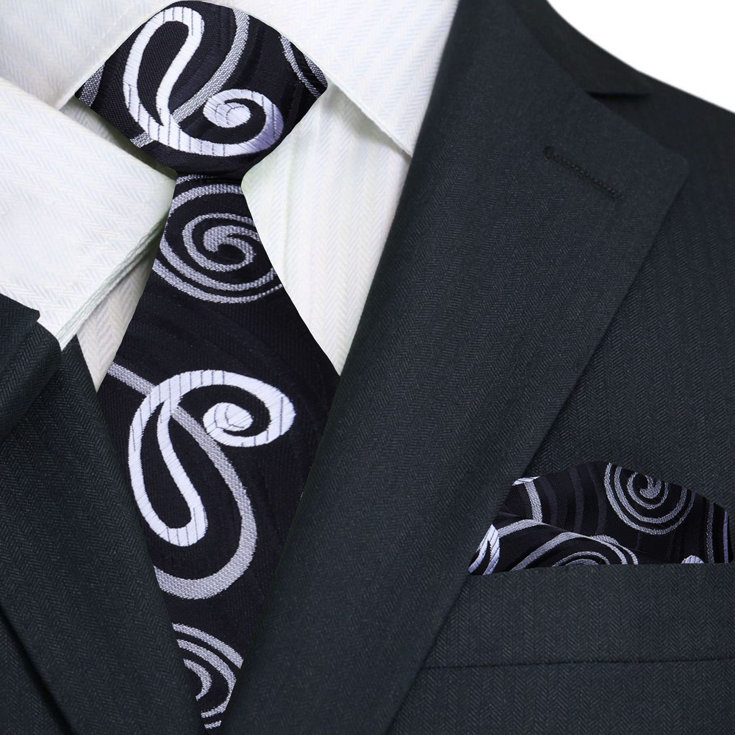 Black suit with a patterned tie and pocket square on a white background