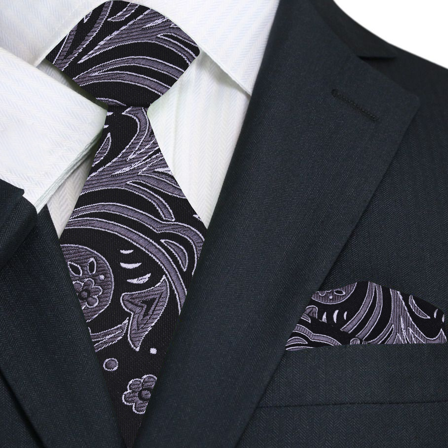 Black suit with a patterned tie and pocket square
