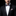 Man wearing a black suit with a patterned bow tie and pocket square on a black background