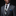 Man wearing a gray suit with a patterned tie and blue pocket square on a black background