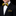 Black suit with yellow and black bow tie and pocket square on a black background
