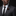 Man wearing brown and black lapel pin
