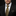Man wearing a black suit with a gold tie and pocket square on a black background