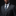 Man wearing a dark suit with a blue tie and pocket square against a black background