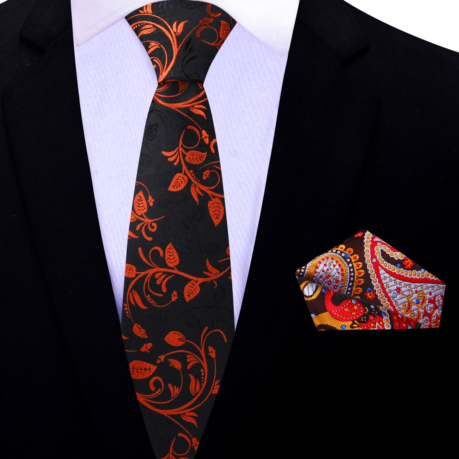 Black tie with red floral pattern and matching pocket square on a suit.
