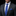 Man wearing a gray suit with a blue checkered tie and pocket square on a black background