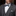 Man wearing a gray suit with a patterned bow tie and pocket square.