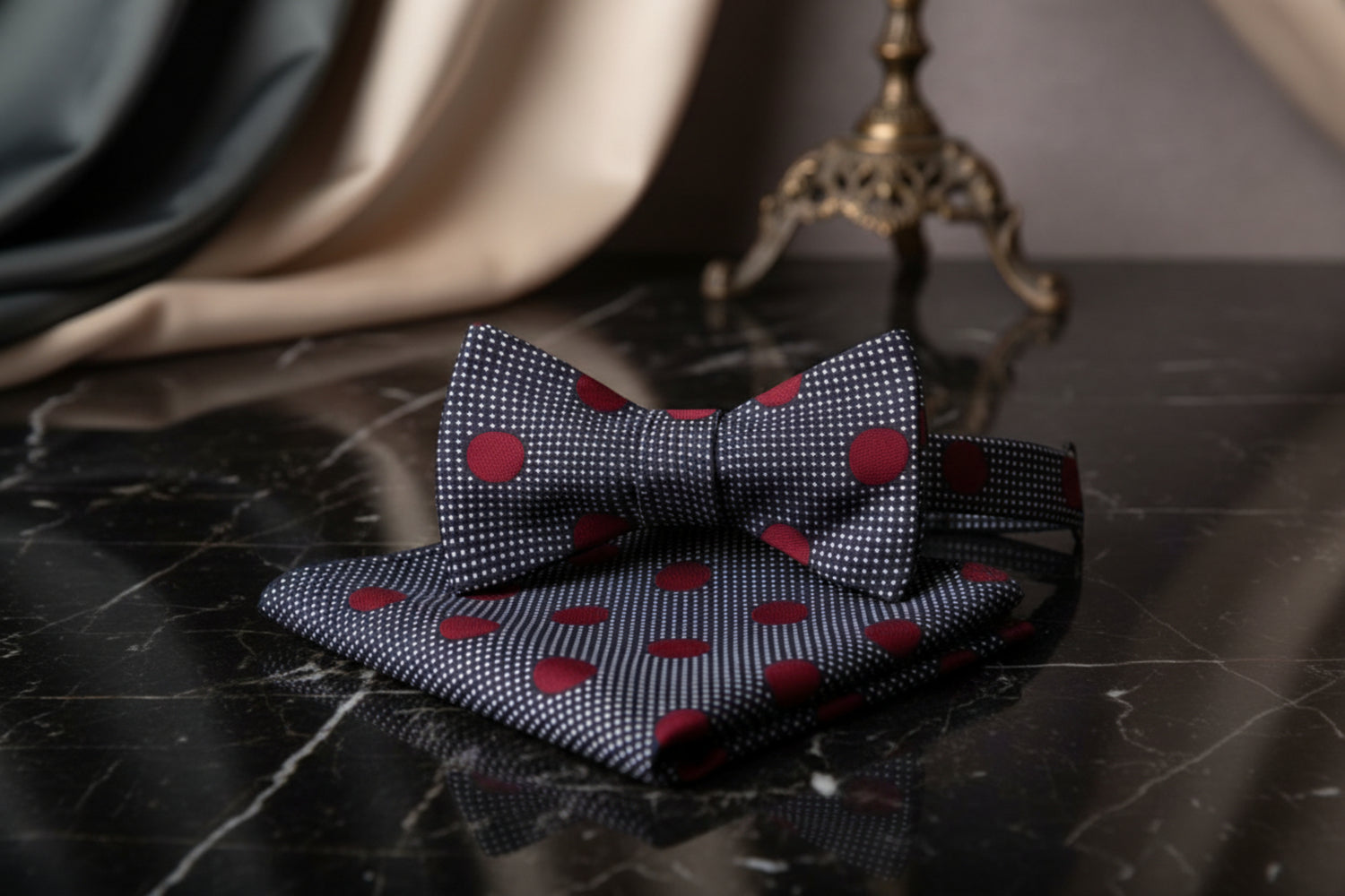 Bow tie and pocket square set with red polka dots on a white background